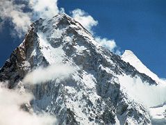 33 Gasherbrum IV And Gasherbrum II Close Up From Baltoro Glacier Between Goro II and Concordia Gasherbrum IV would probably be a more popular climbing mountain if it was 75m taller. At 7925m, it is the 17th highest mountain in the world. Gasherbrum II (G2, 8035m) pokes out to the right of Gasherbrum IV. On June 22, 1986 Greg Child, Tim Mcartney-Snape, and Tom Hargis climbed to the North Summit and traversed 450m horizontally to the true Gasherbrum IV Summit, completing the first ascent of the Gasherbrum IV Northwest Ridge. �We functioned as a single being. Now on the summit, that being, drunk with euphoria, felt suddenly as if it had been merged with sky and mountain as well to become a single, elemental entity.� - Thin Air: Encounters In The Himalaya by Greg Child.